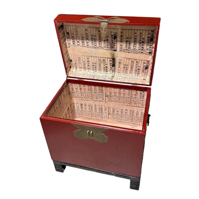 Wonderful little red Chinese tansu chest with brass butterfly hardware on the front. There is space for a lock on the...