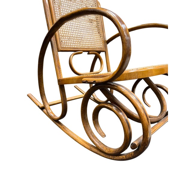This bentwood rocking chair is a classic example of the elegant, curvilinear design Attributed to Michael Thonet and his...