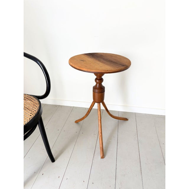 A striking early 20th century side table with a circular top and splayed bentwood legs. This 1920’s occasional table...