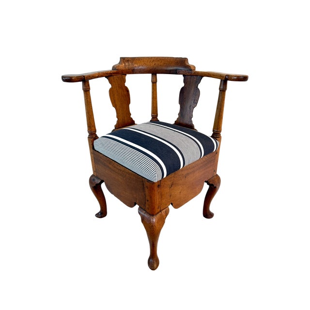 A rare and beautifully preserved 18th C George II "roundabout" or corner commode chair, crafted from solid walnut wood...