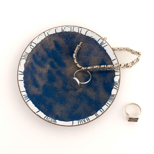 Round decorative catchall dish with elegant hand-painted design in rich blue, white, and gold enamel. Signed 'EMS' on...