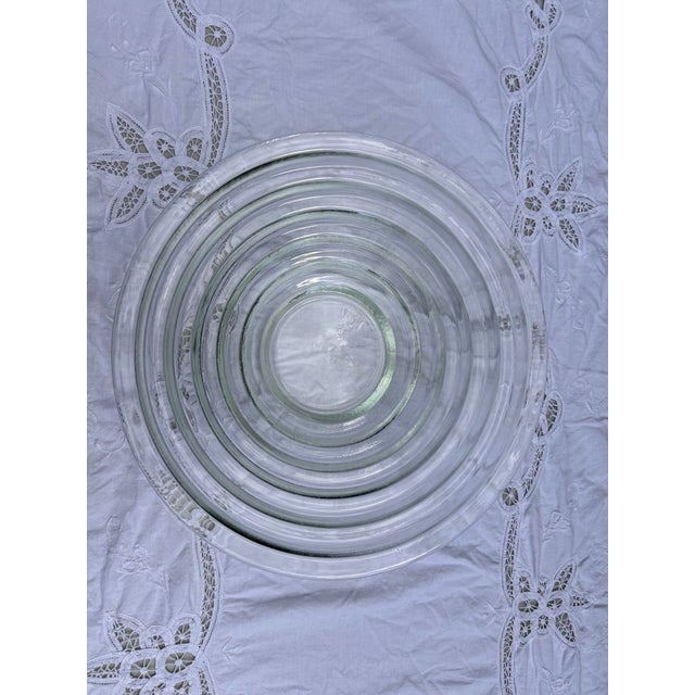 This stunning seafoam green glass bowl replicates Walter Dorwin Teague's iconic Steuben style lens bowl from the 1930s....