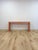 This fun and eye-catching vintage salmon laminate narrow console table is a bold and characterful retro accent find. The...