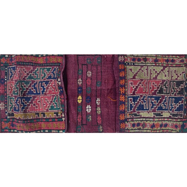 This charming antique tribal storage bag displays a bold and highly decorative geometric design characteristic of the...