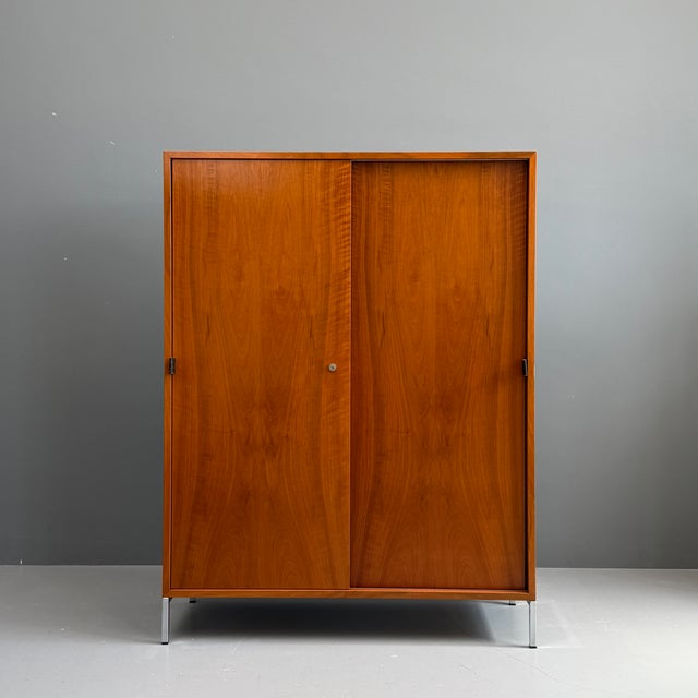 Walnut Wardrobe by Florence Knoll for Knoll International, 1960s, in Good conditions. Designed 1960 to 1969 This piece has...