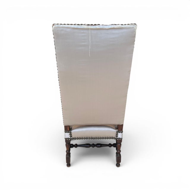 Generous proportions make this chair a favorite for all. Curved arms cascade down to the turned legs and stretchers. Needs...