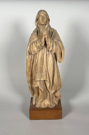 16th-century wooden sculpture of the Virgin Mary in prayer