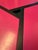 Modern postmodern accent / side tables featuring a striking geometric architectural design with shocking pink segmented...