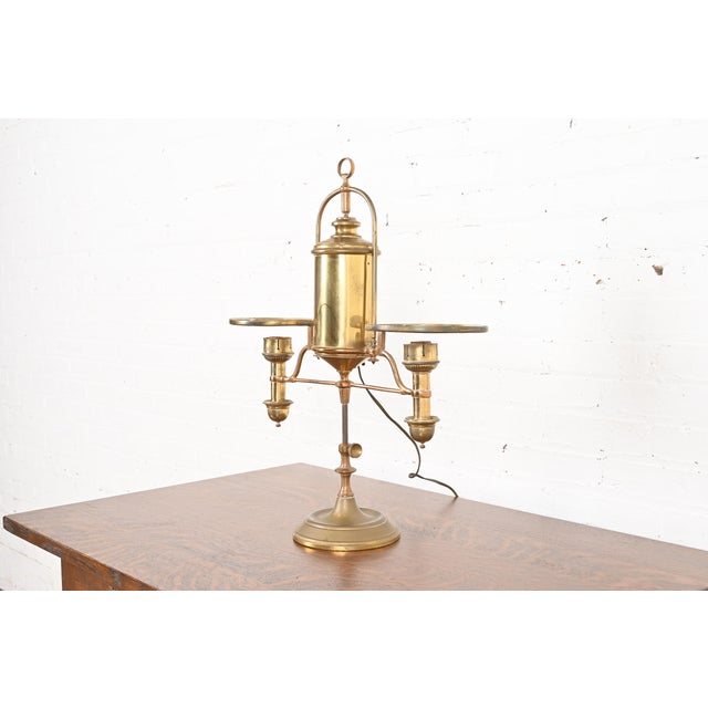 A gorgeous antique Arts and Crafts or Art Deco brass double arm student lamp or desk lamp In the manner of Tiffany Studios...