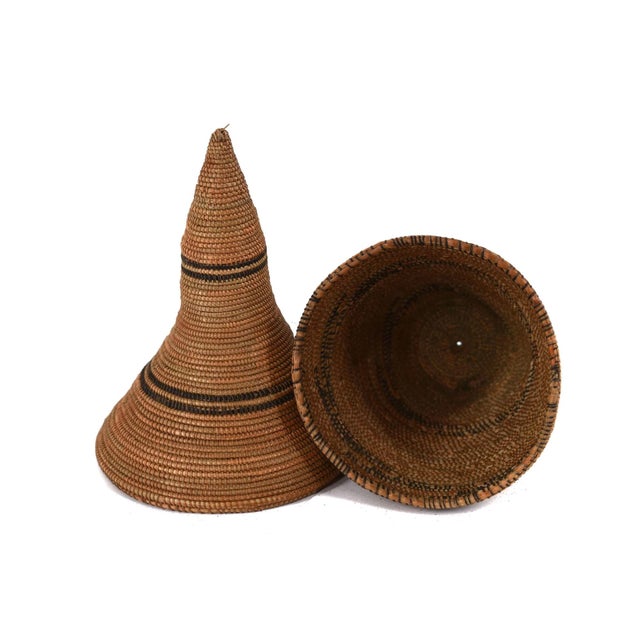 The Tutsi Tight Weave Basket with Lid from Rwanda epitomizes the artistry and tradition of the Tutsi community's weaving...