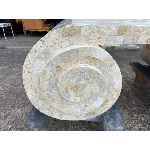 Maitland-Smith Tessellated Travertine Scroll Cocktail Table. Offered is an unusual Post-Modern tessellated travertine...