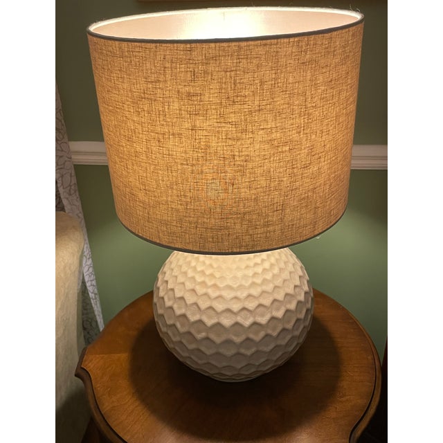 This lamp is a Livabliss Rustic Emma Table Lamp (also sold as the Surya Blakely Table Lamp). It features a teardrop-shaped...