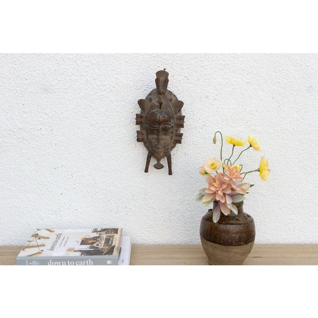 This charming Kwele mask from Gabon or the Republic of Congo is a delightful example of African tribal art. The surface is...