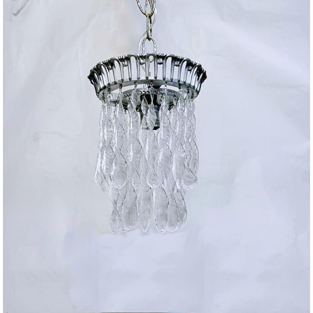 This light fixture is a vintage Murano glass leaf or teardrop chandelier with a small, double-tiered design and a siler...