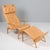 Bruno Mathsson Pernilla lounge chair with ottoman, original light leather upholstery. Frame in lacquered beech. Made by...