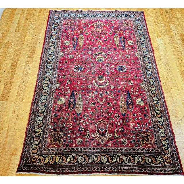 A rare and profoundly symbolic 19th century Persian Khorassan rug features an extraordinary allover “Tree of Life”...