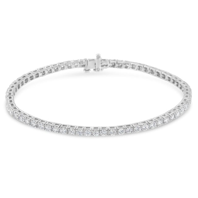 Elevate her attire with the luxe look of this magnificent diamond tennis bracelet. Elegant and timeless, this gorgeous 14K...