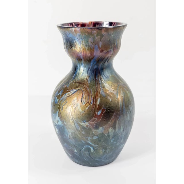We are selling this stunning Art Nouveau iridescent art glass vase. This glass vase probably comes from Bohemia and is...