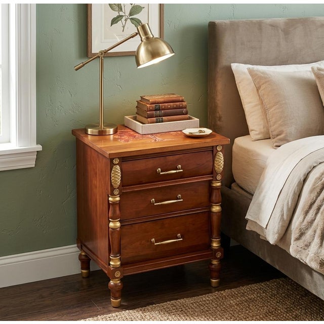 Bring warm elegance and artisan charm into your home with this beautiful solid wood three-drawer nightstand/accent chest!...