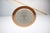 A distinctive vintage pendant light dating from the 1970s, featuring a copper-colored metal shade, white enamelled central...