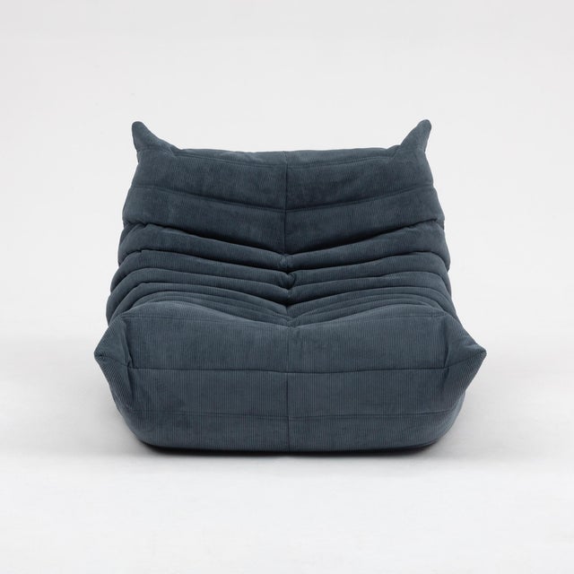 An authentic vintage Ligne Roset Togo fireside chair with matching ottoman, designed by Michel Ducaroy in 1973 - sourced...