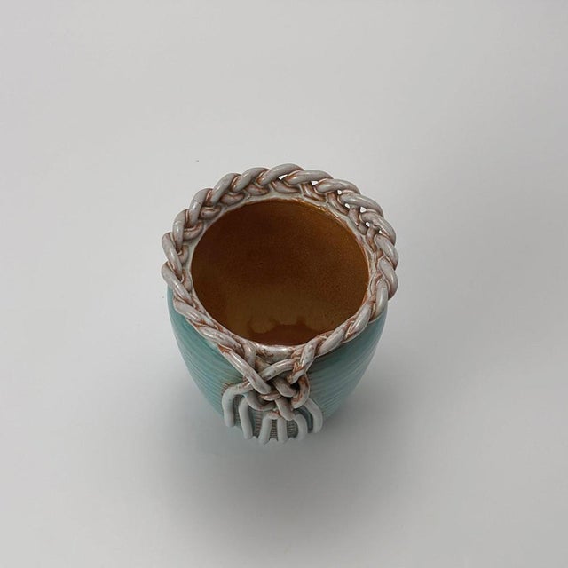 A handmade turquoise ceramic vase by Alexandre de Wemmel, crafted in Belgium during the 1950s. This distinctive mid-...