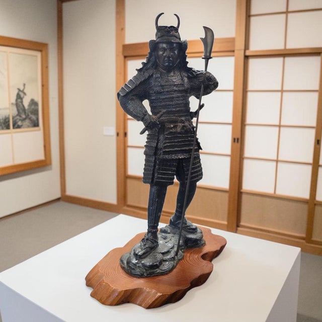 A substantial late 20th-century Japanese samurai warrior sculpture with exceptional architectural presence and richly...