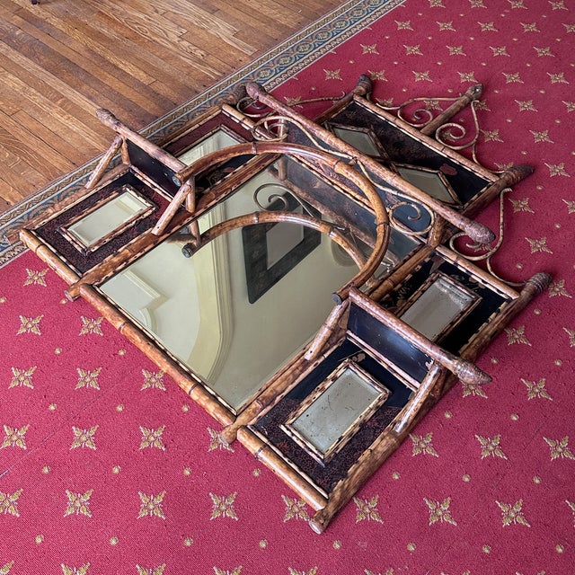 Antique English Bamboo Mirror with Shelves A gorgeous, likely 19th century, arched mirror with intricate scroll detail and...