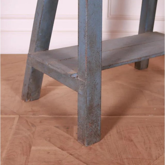 Small English painted and scrubbed pine trestle table. 1890. Top depth of 15". This piece is designed in the style of the...
