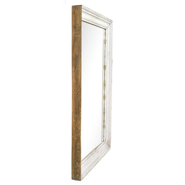 This solid wood vertical mirror is attractive thanks to its original white patina and its slightly chipped molded frame,...
