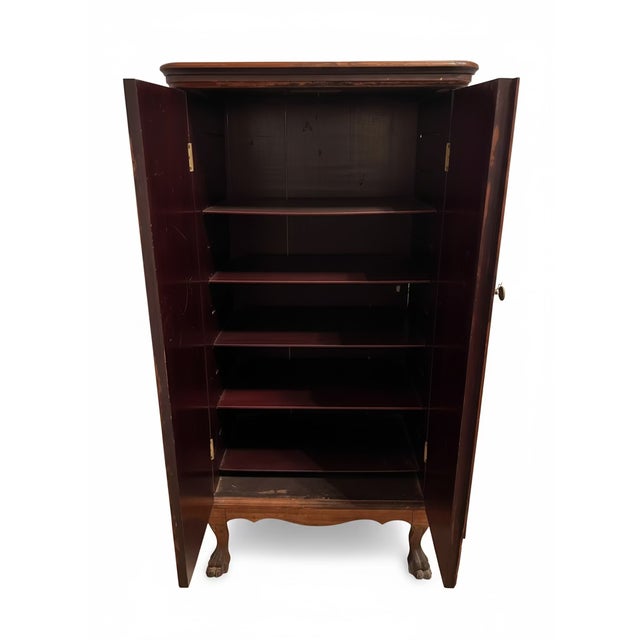 A refined balance of function and charm, this vintage wooden cabinet brings storied character to any space. Raised on...