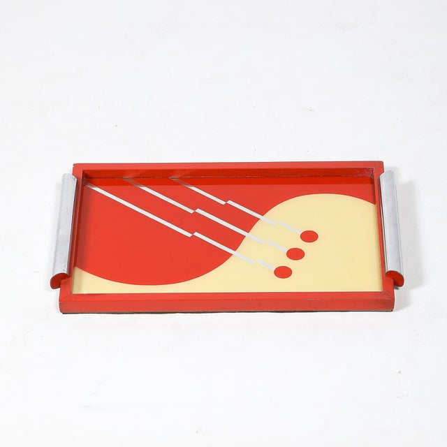 This striking Art Deco églomisé tray, crafted in America circa 1935, is a perfect example of the bold graphic design and...