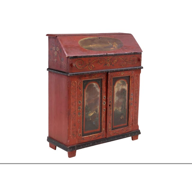 A wonderfully characterful 19th-century Continental slant-front secretary, possibly Northern European, retaining a richly...