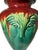 This decorative vintage art pottery handle vase features a burnt red-to-green “lava drip” style glaze with an elephant...