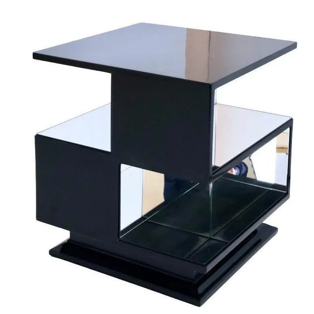 Cubist table Art Deco France around 1930. Black lacquer with mirror glass. Meander shape – strict early style. Cube with...