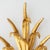 Pair of Italian gilt brass wheat sheaf wall sconces in the Hollywood Regency style. This pair is a later production made...