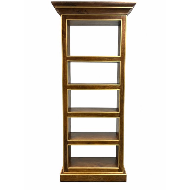 Design Plus Gallery presents the Library Bookcase from Global Views. The walnut-toned mango wood frame is detailed with...