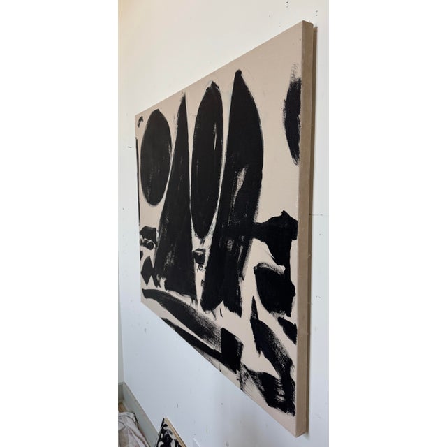 This painting was created with energy, spontaneity, and confidence. Bold black forms layered against a warm tan background...