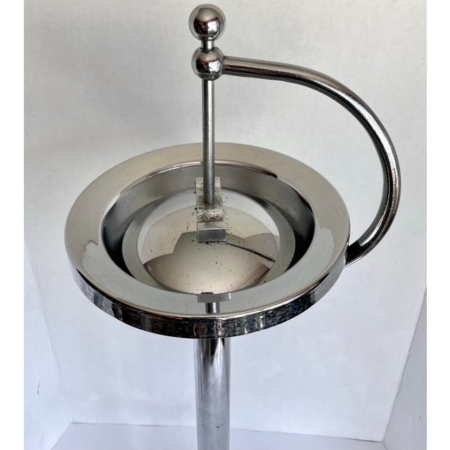 Here is a fabulous vintage sculptural chrome floor ashtray, featuring a streamlined Mid-Century Modern design with a...