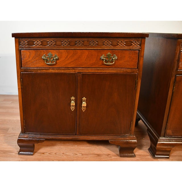 We are pleased to offer this beautiful pair of english chippendale mahogney Nightstands, from the 1960 made by baker...