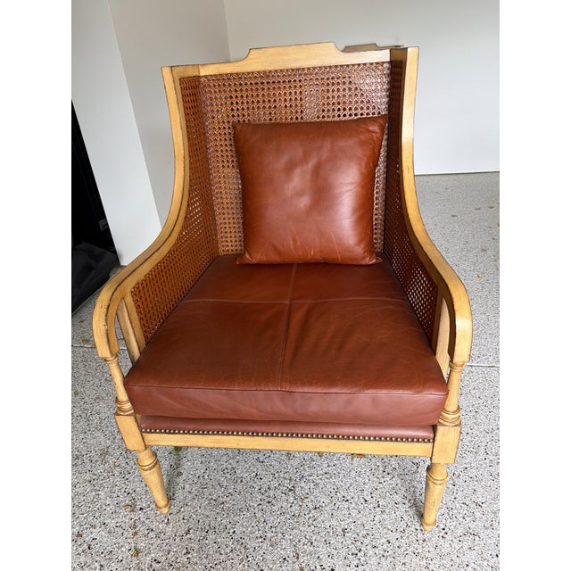 Elegant set of four French-style Bergère wingback chairs featuring woven cane backs and sides, a lightly pickled wood...