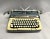 A mid-century Smith-Corona Classic 12 typewriter. The portable typewriter was part of the Series-6 model and one of its...