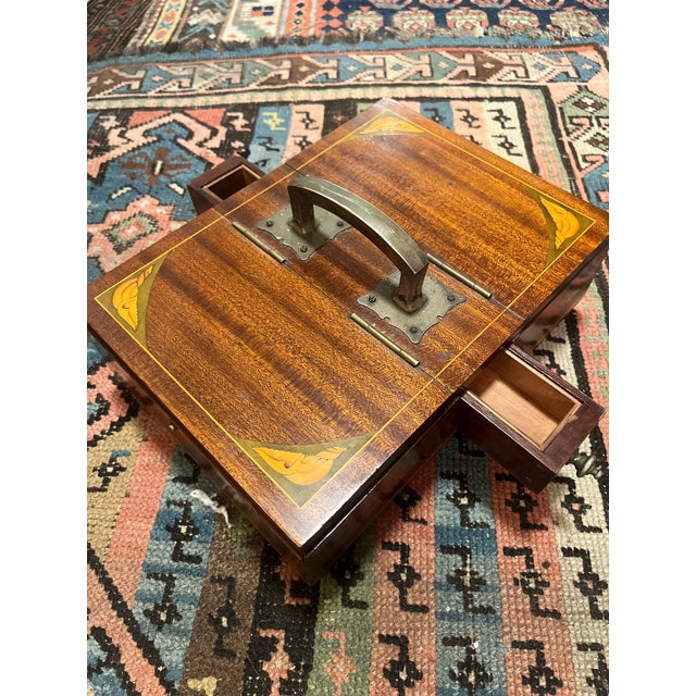 This antique American mahogany inlaid compartment box from the 19th century is a medium-sized, rectangular-shaped piece...