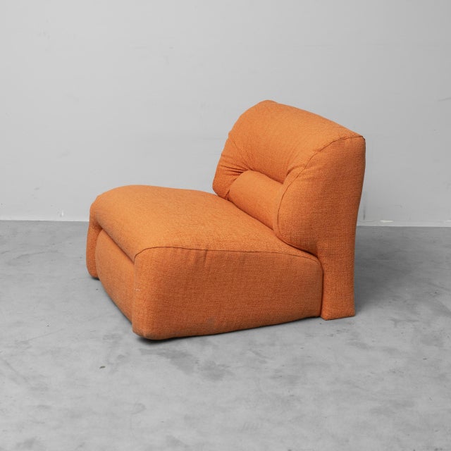 Armchair made in the 1970s. Upholstered in orange fabric. Excellent condition, as shown in the photos.
