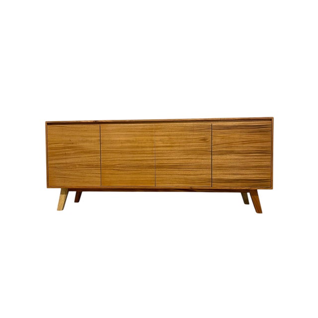 Mid century modern style credenza made using pine wood and parota wood veneer. Light and sturdy construction Note: wood...