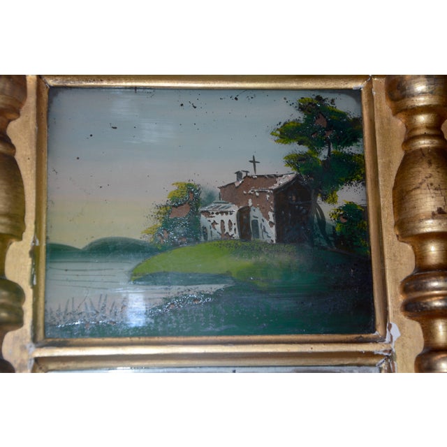 A church by the river sets the tone of this beautiful gilded mirror. The scene is reverse hand-painted. The frame is...