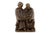 This bronze sculpture features two robed figures leaning toward one another in a moment of shared reading. The characters...