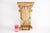 A large salvaged architectural stripped wooden hand-carved corbel with natural grain, nail holes and old repairs, a flat...