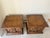 Sophisticated and stately, this exceptional pair of vintage commode-style end tables was produced in the 1960s by the...