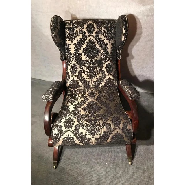 This exquisite Biedermeier Sleigh Back Wing Chair, dating back to 1825–1830, is attributed to the esteemed architect and...
